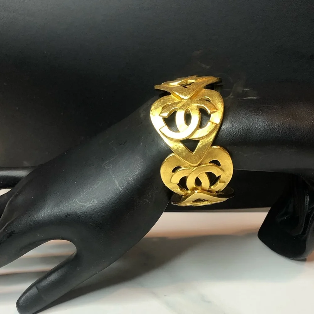 CHANEL Gold Cuff Bracelet with Interlocking CC Open Heart Design